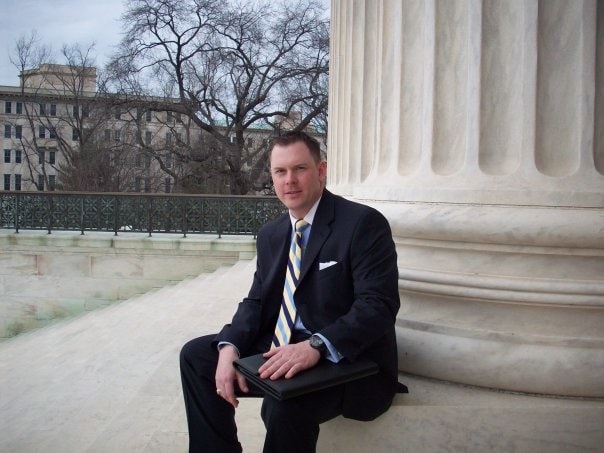 Patrick Almand on the steps of a federal courthouse